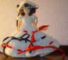 7" doll with blue/red ribbon dress