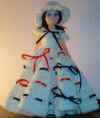 15" doll with blue/red ribbon dress