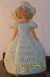 7" doll with yellow ribbon dress